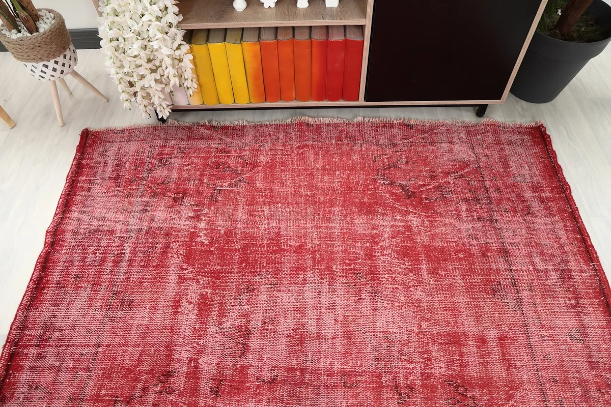 Overhead view of the rug placed in a room, showing its full length