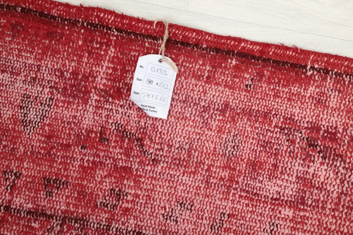 Close-up of the rug's surface with an attached product tag