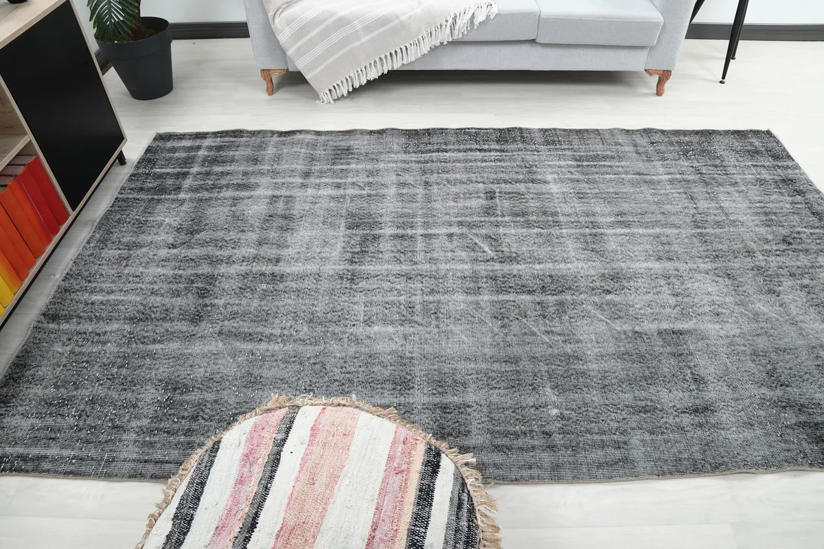 Rug in a room, offering a perspective on its size and how it complements the surrounding decor.