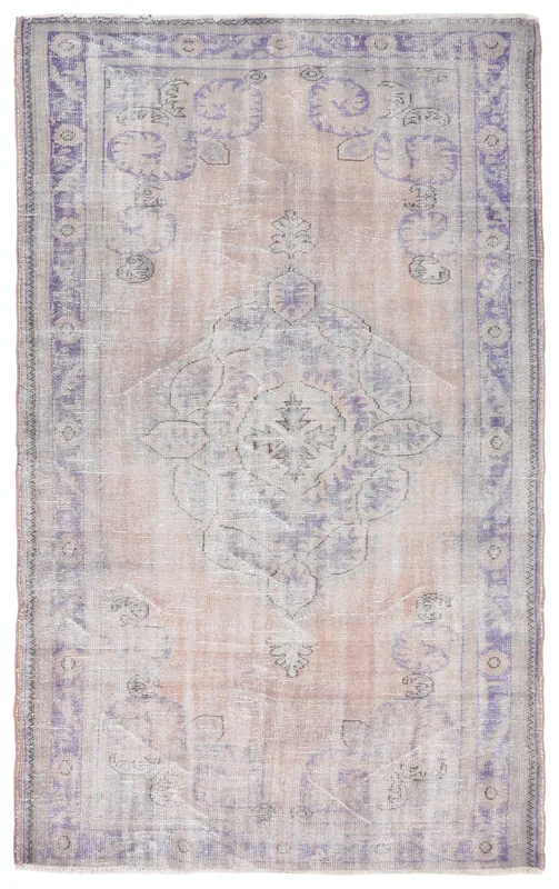 Full top view of the vintage Anatolian rug with faded orange and purple colors