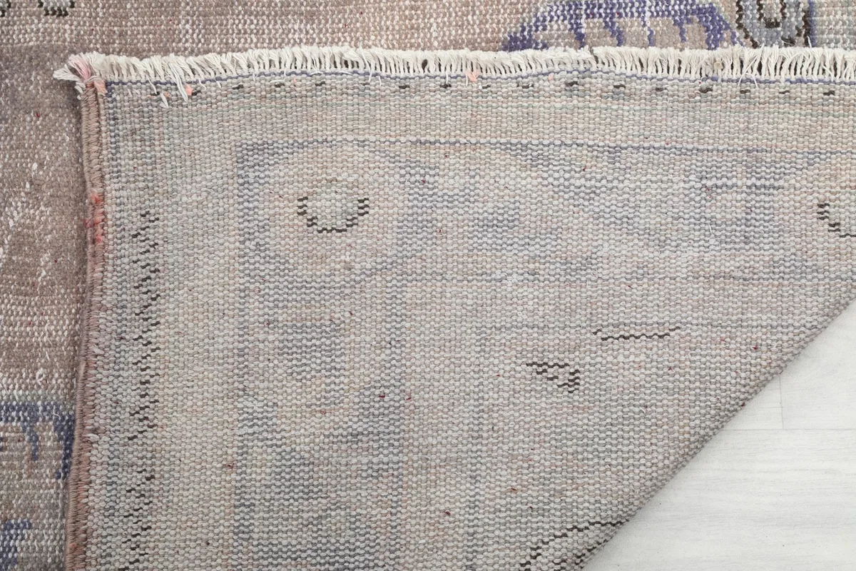 Underside of the rug, showing the hand-knotted cotton foundation