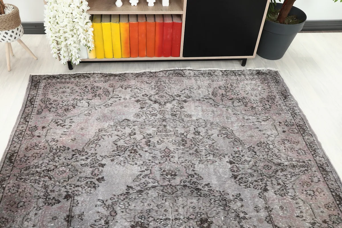 Overhead view of the rug, capturing the full medallion pattern and color variations from a higher perspective.