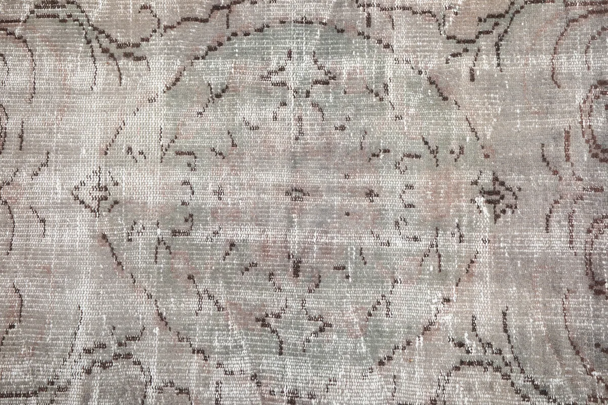 Close-up of the central medallion on the Gray Medallion Anatolian Rug, with faded rose hints.