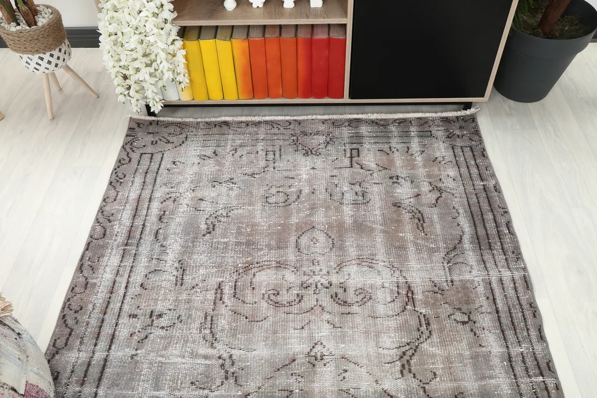 Gray Medallion Anatolian Rug from a higher angle, showing the overall faded pattern.