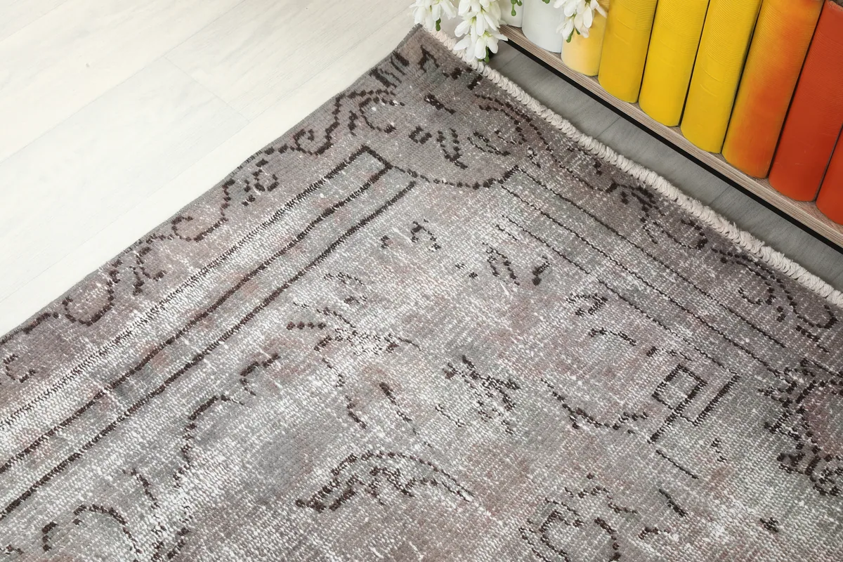 Detail of the Gray Medallion Anatolian Rug's border, showcasing its traditional motifs.