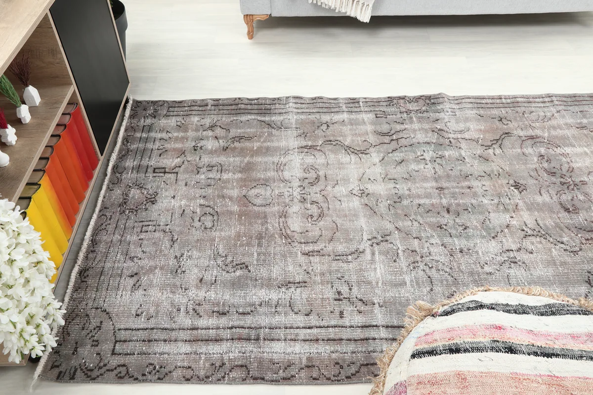Gray Medallion Anatolian Rug in a room, offering a wide perspective of its placement.