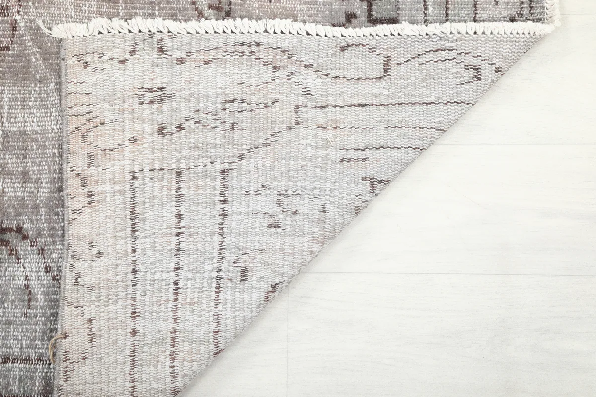 The underside of the Gray Medallion Anatolian Rug, revealing the hand-knotted construction.