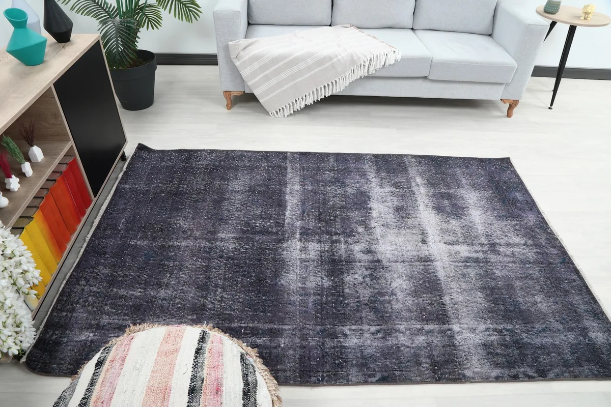 Vintage Anatolian rug laid out in a contemporary room, providing scale and style context.