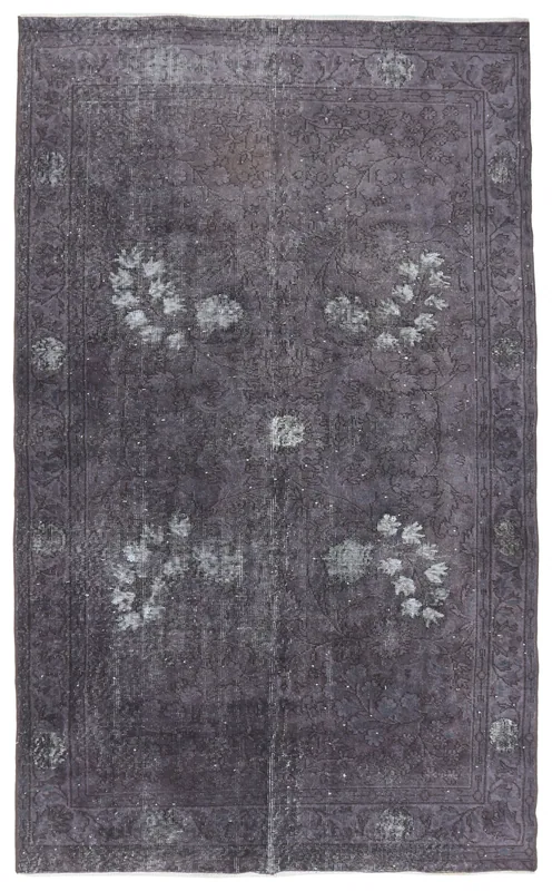 Full top view of the 5'2" x 8'6" charcoal vintage Anatolian rug on a white background