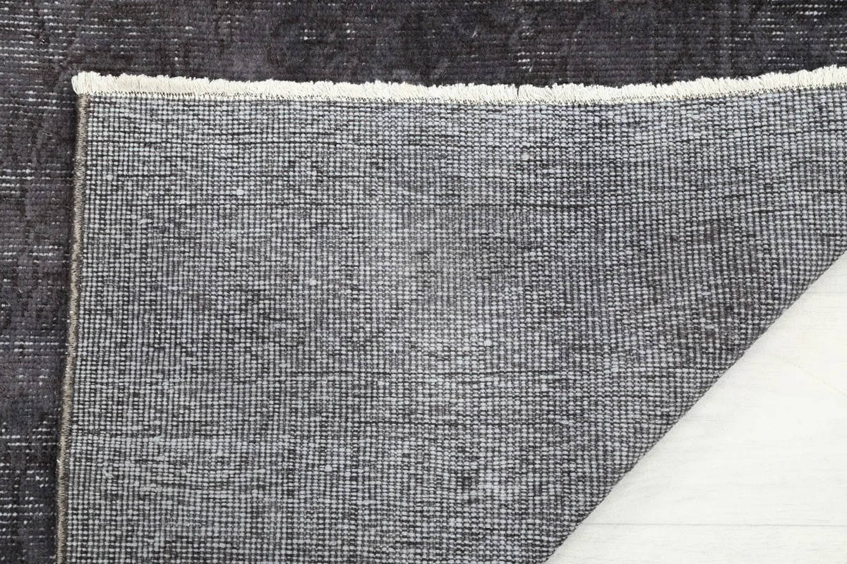 Close-up of the hand-knotted cotton foundation on the back of the vintage Anatolian rug