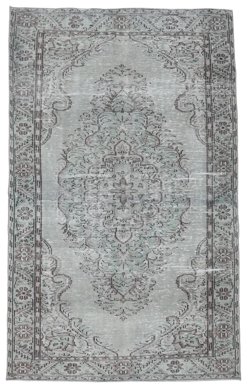 Full top view of the 5'9" x 9'7" gray and charcoal vintage Anatolian rug