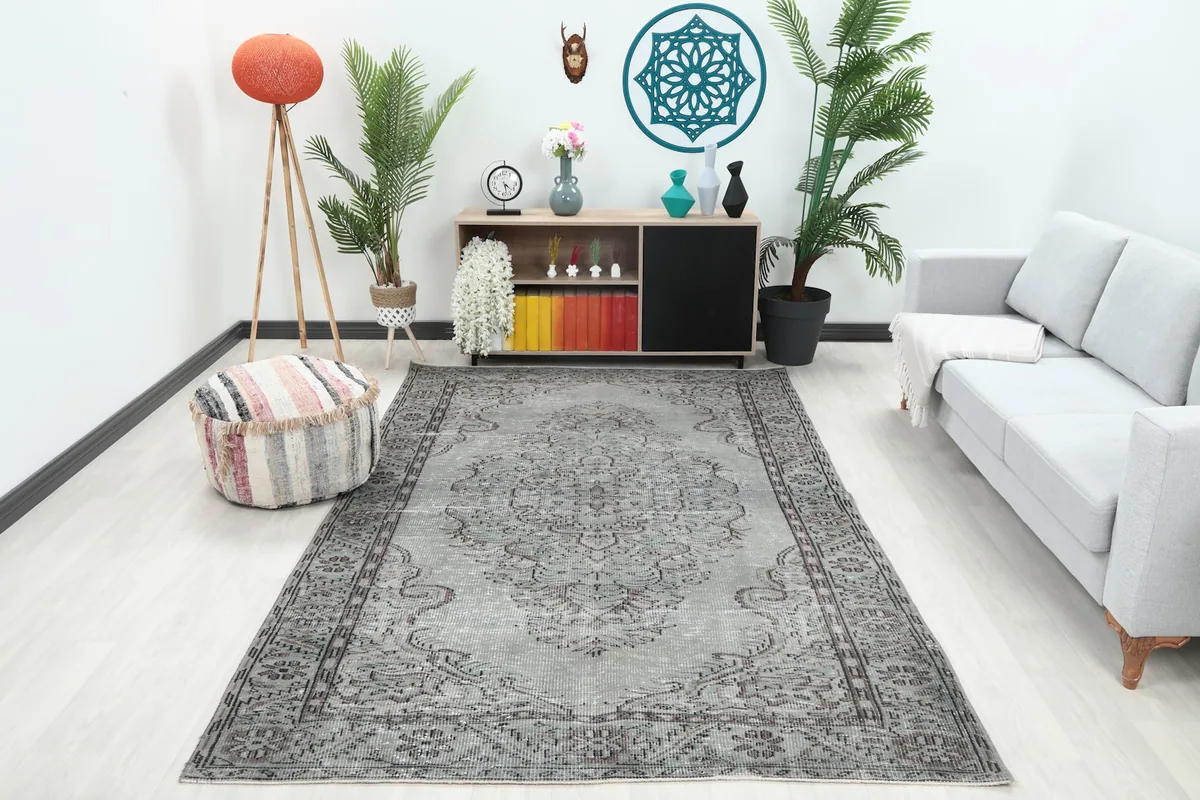Vintage gray and charcoal rug styled in a modern living room setting