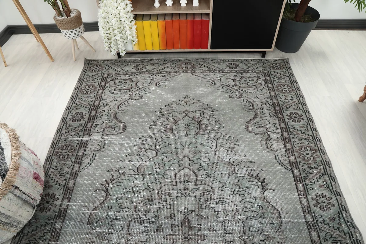 Overhead view of the rug placed in a room, showing its full size and design