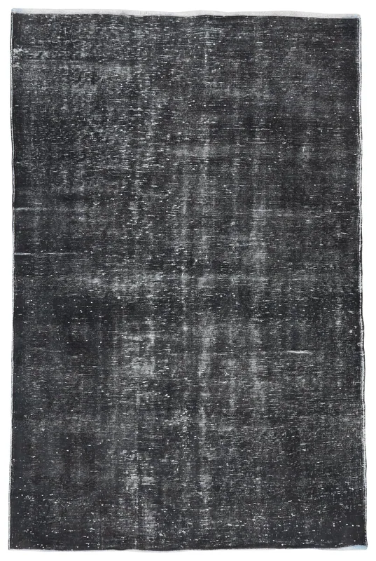 Full overhead view of the charcoal vintage Anatolian area rug with distressed patina