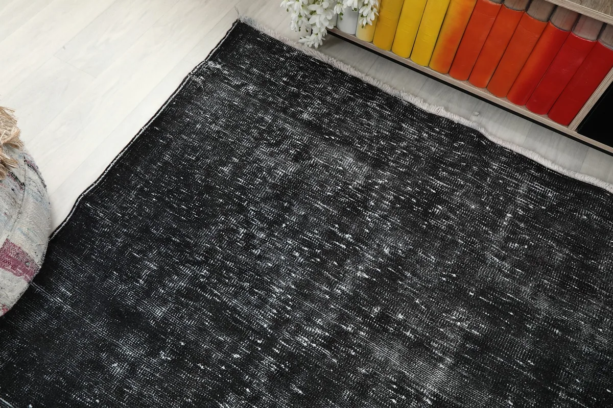 Overhead view of the charcoal rug in a room, showing its placement relative to furniture