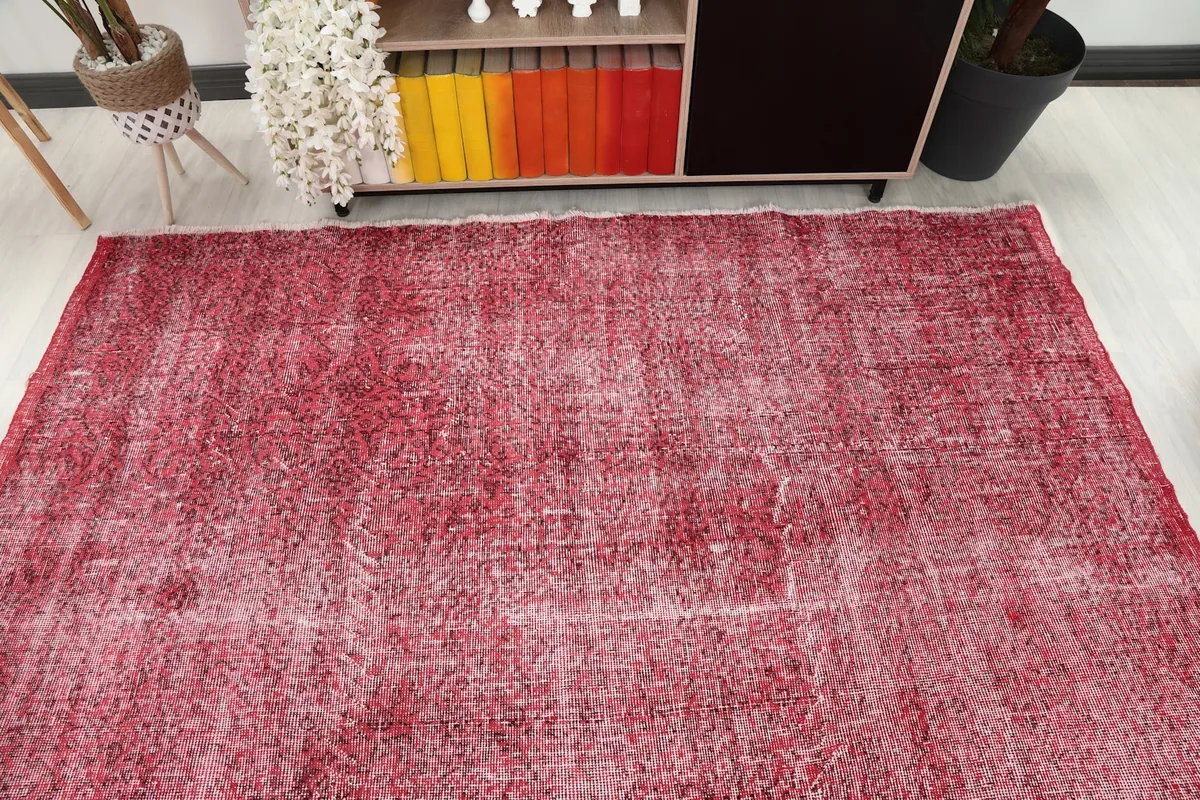 Overhead view of the rose rug in a room, showing its placement relative to furniture