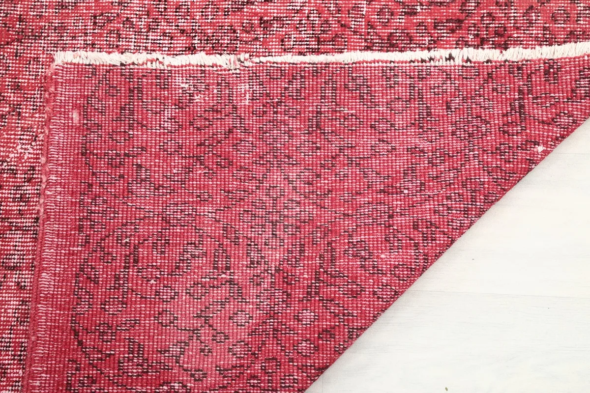 Close-up of the back of the hand-knotted rug, showing the cotton foundation and knotting