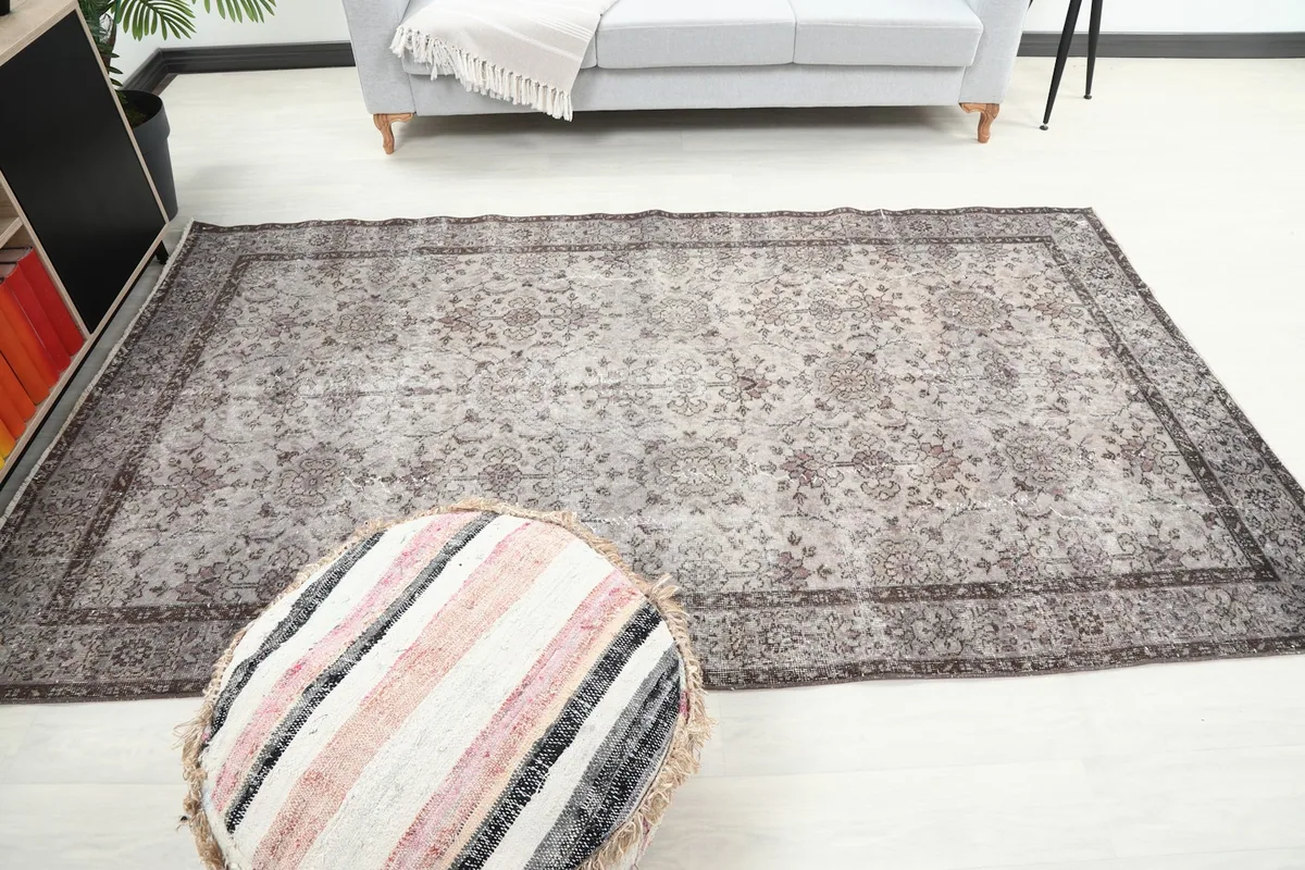 Wide shot of the rug in the room, showing its dimensions and how it anchors the space