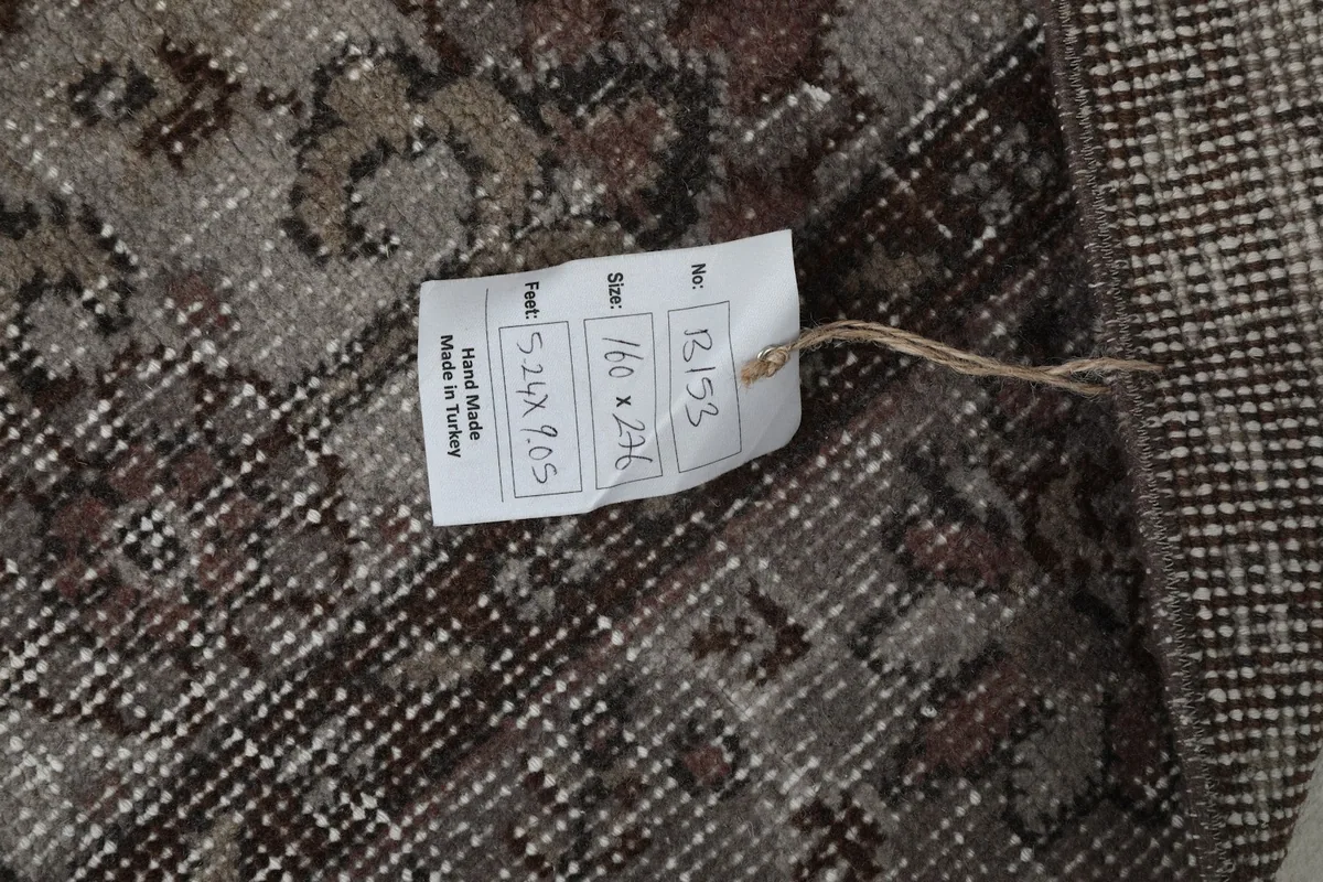 Tag on the back of the rug displaying size and origin information