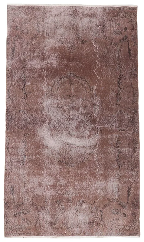 Full top view of the 5x9 rust vintage Anatolian area rug with a faded medallion design