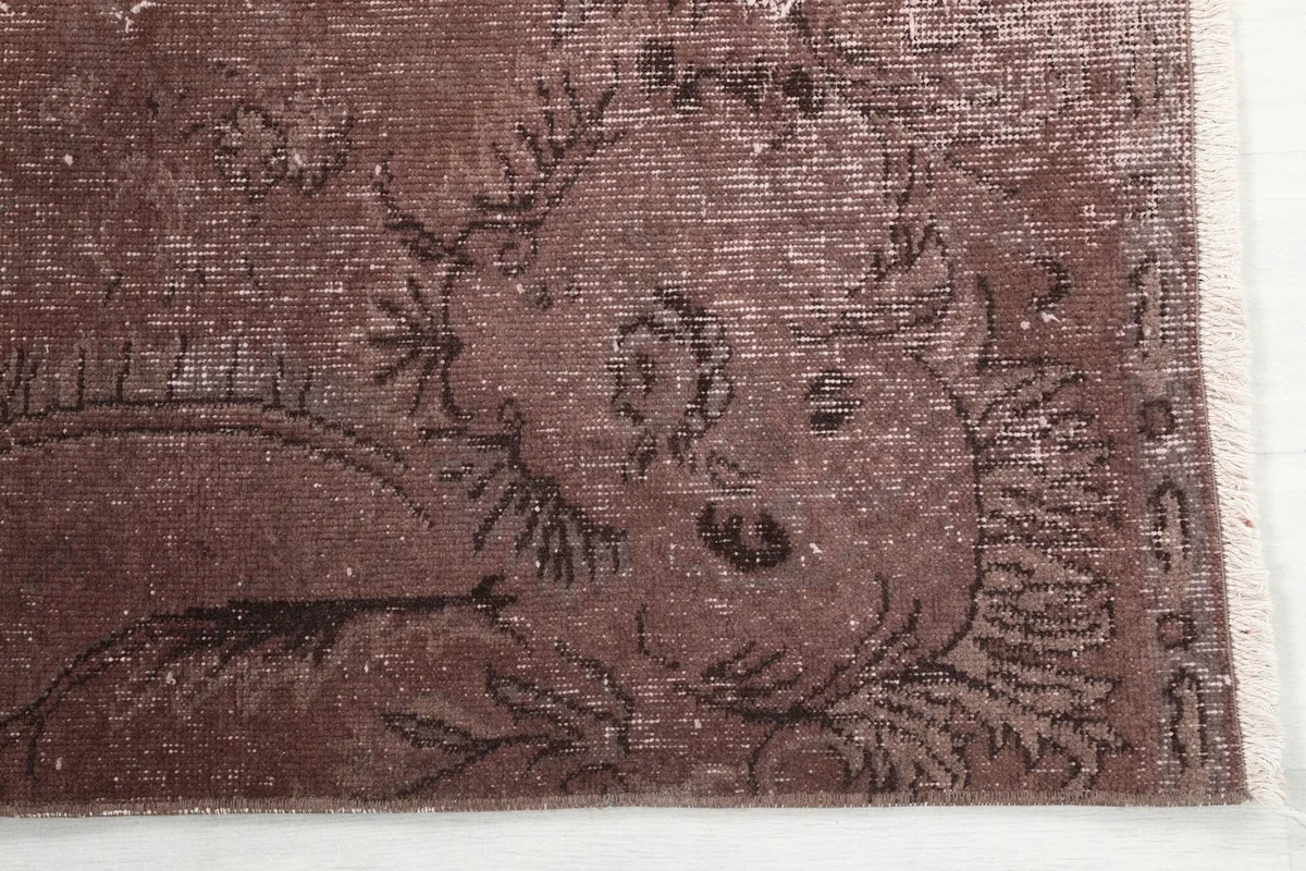 Detailed view of the rug's border and corner, highlighting the hand-knotted texture