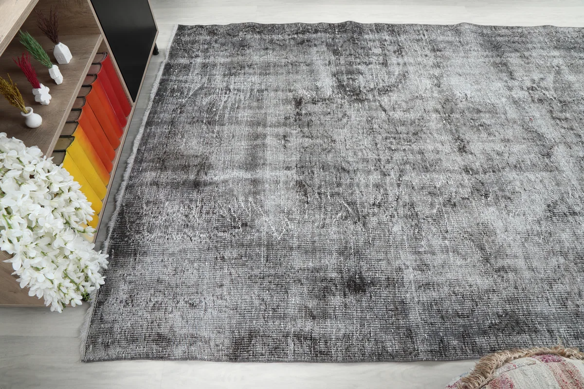 Charcoal Faded Abstract Rug shown in a room from a different perspective, illustrating its versatility.