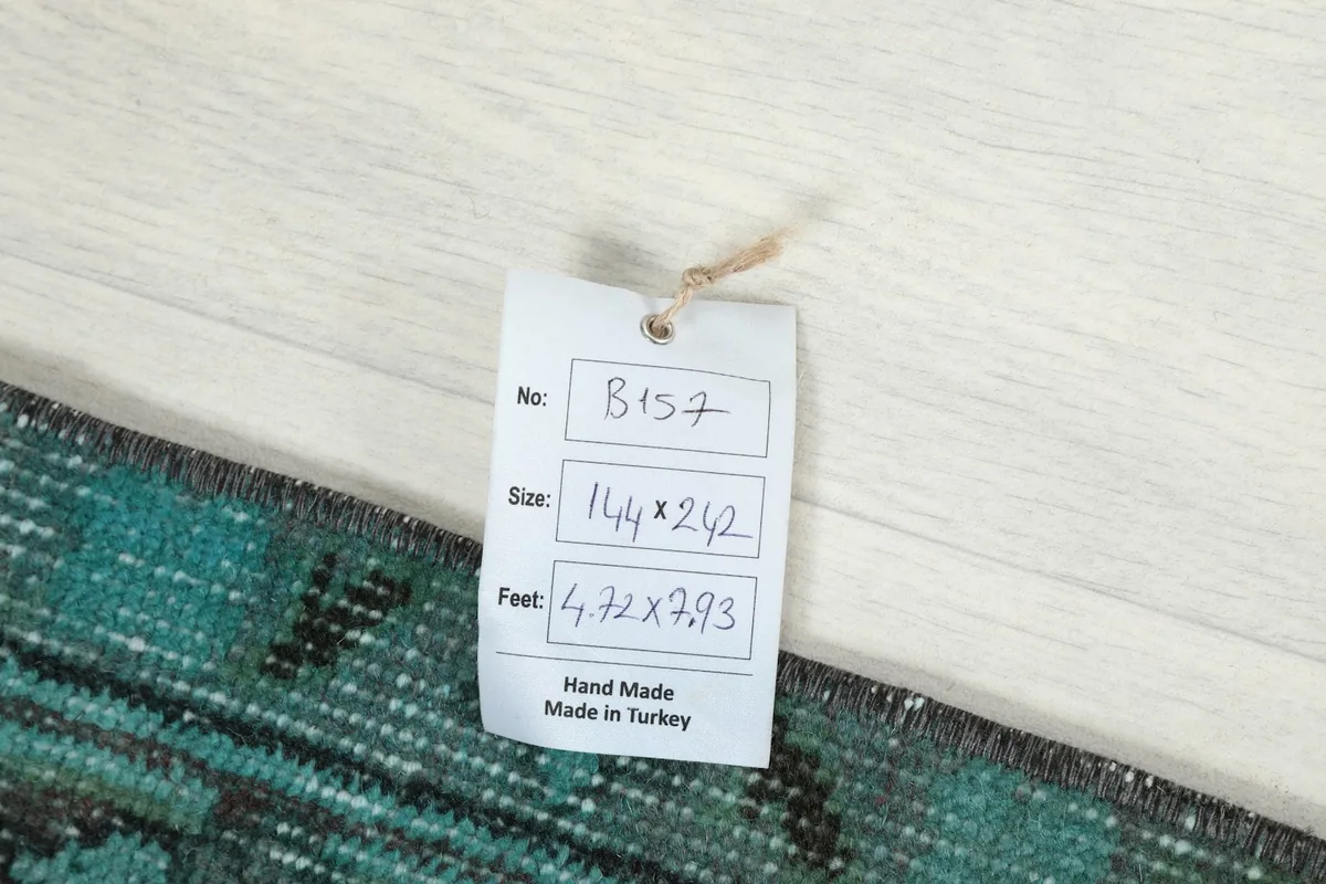 Close-up of the product tag showing size and origin details