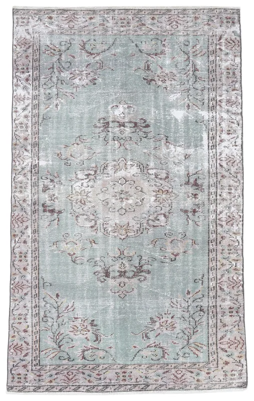 Full top view of the 5x8 vintage Anatolian rug with a gray field and rose floral patterns