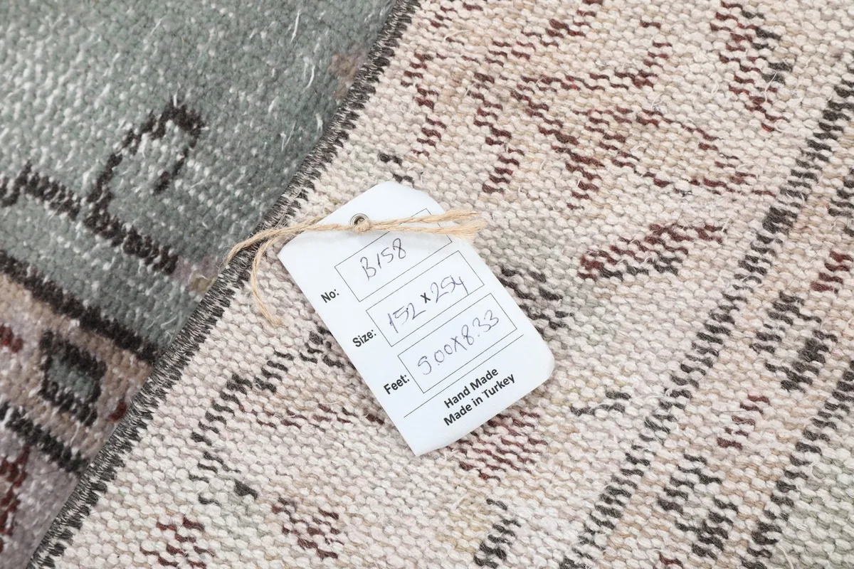 Product tag on the back of the rug, detailing its size and origin