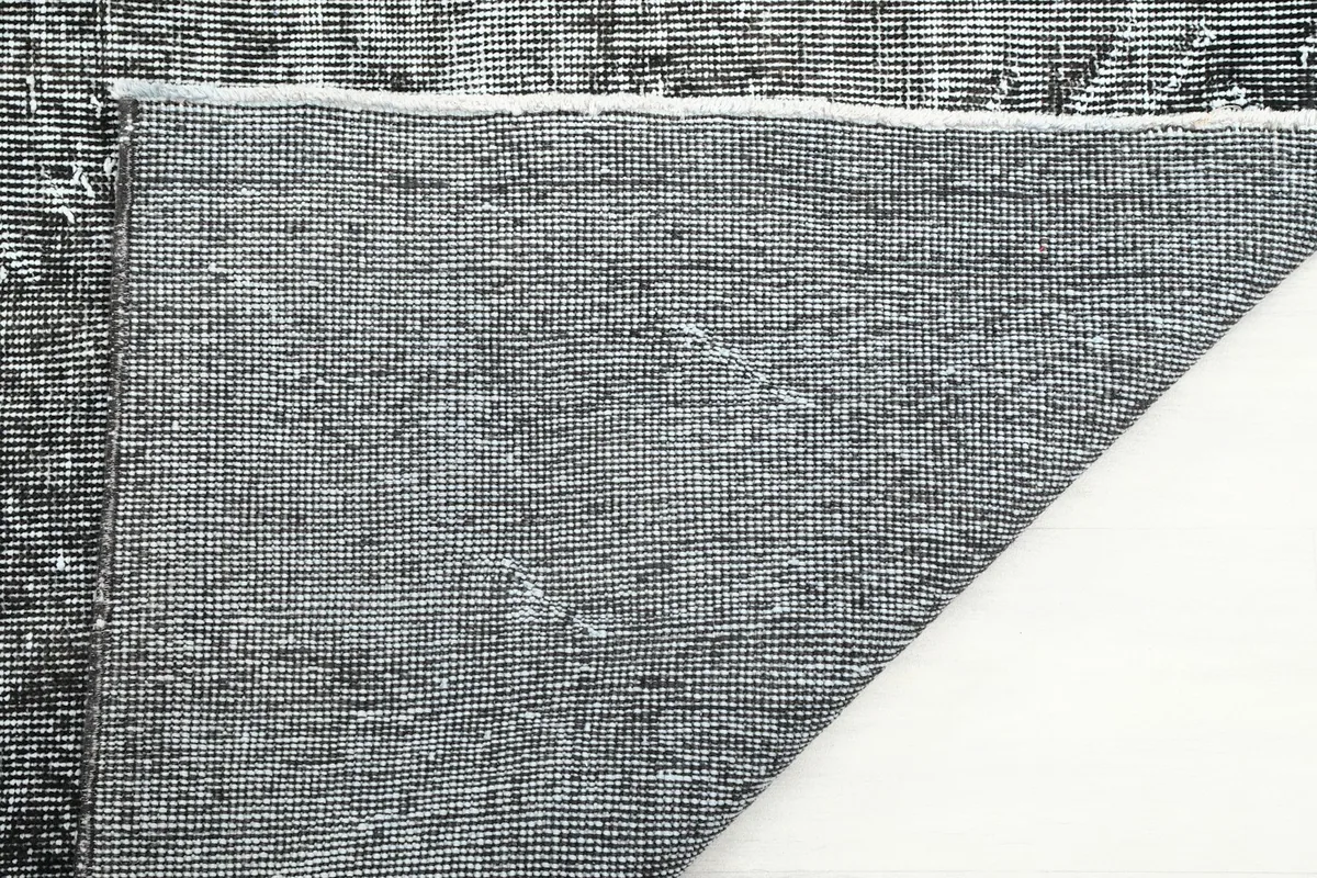 Close-up of the rug's cotton foundation from the reverse side
