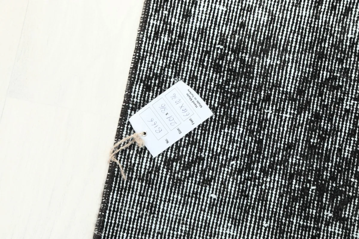 Label attached to the rug, showing details and quality information