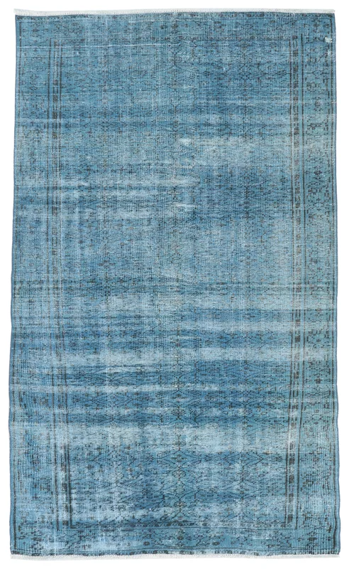Full top view of the 4'9" x 8'6" blue distressed vintage Anatolian area rug on a white background.