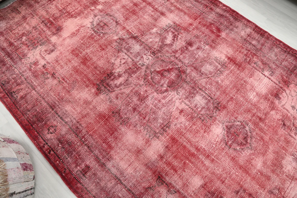 Detailed view of the Faded Rose Geometric Vintage Rug, showing the distressed geometric motifs.