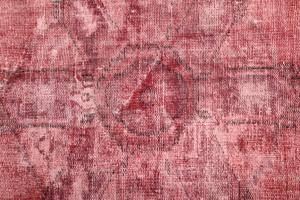 Close-up of the low pile and texture of the Faded Rose Geometric Vintage Rug.