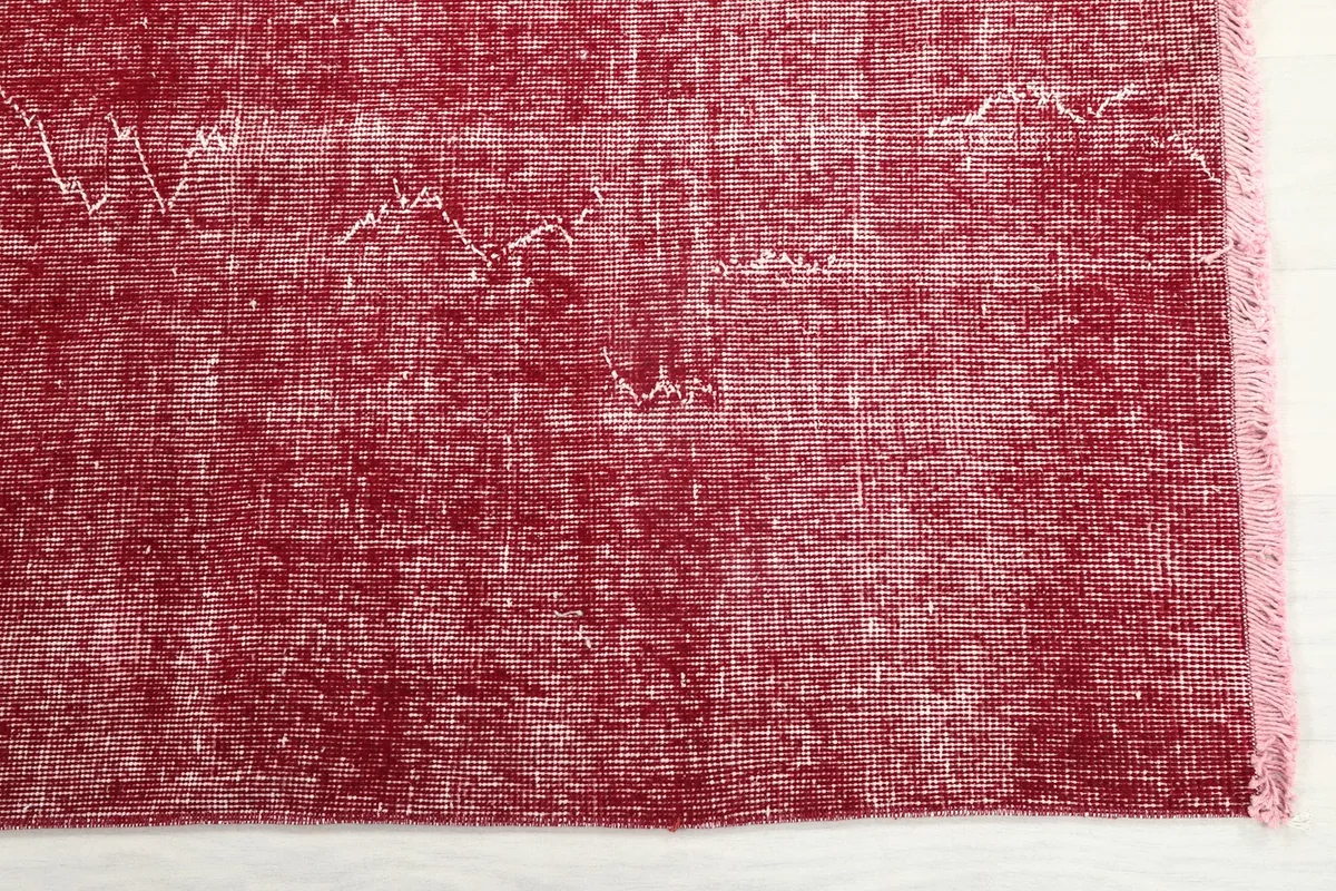 Detail of the rose field with subtle white distressing and fringed edge