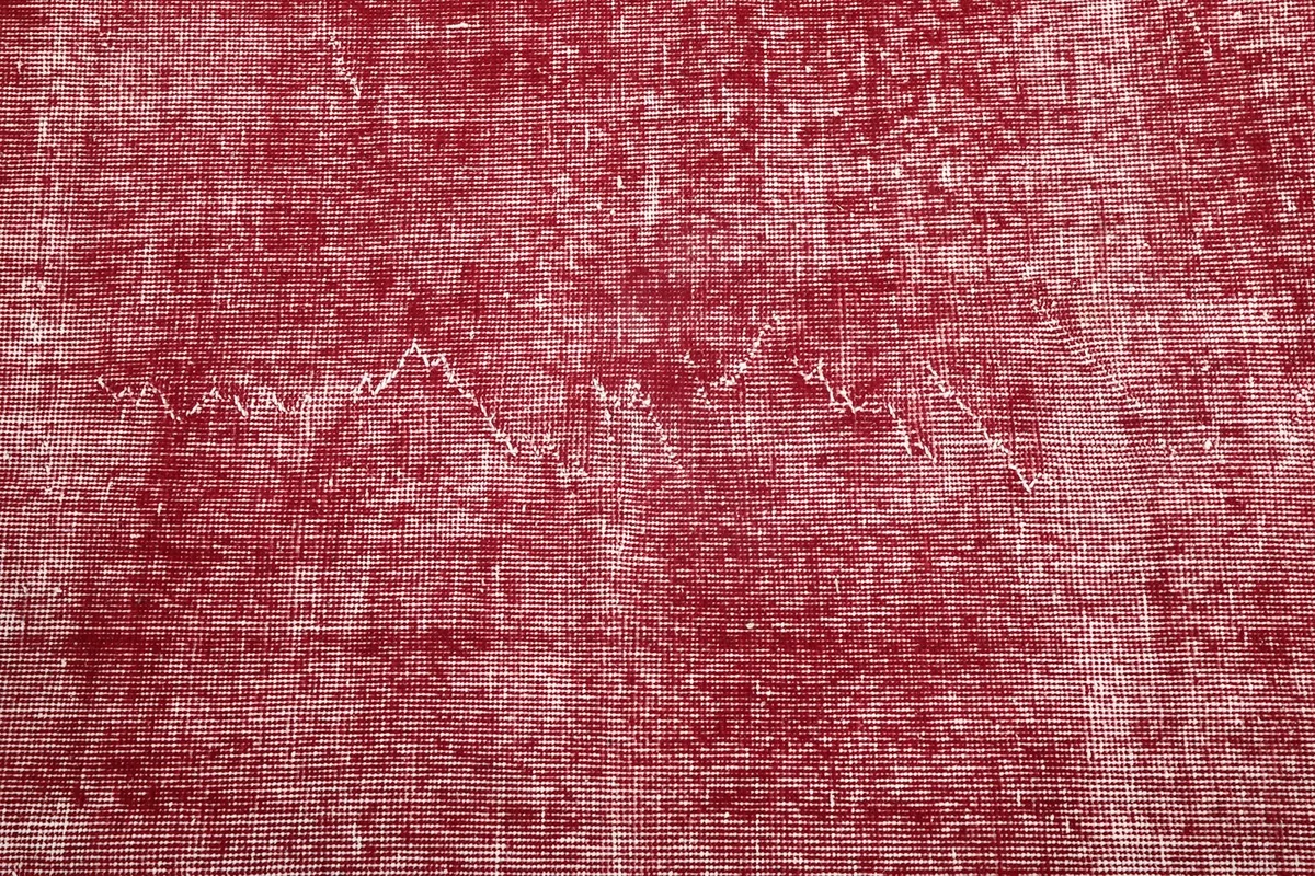 Close-up of the distressed rose pile with visible weaving patterns