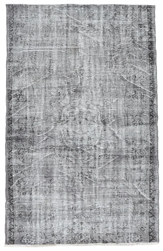 Full overhead view of the charcoal and gray vintage Anatolian rug with faded patterns