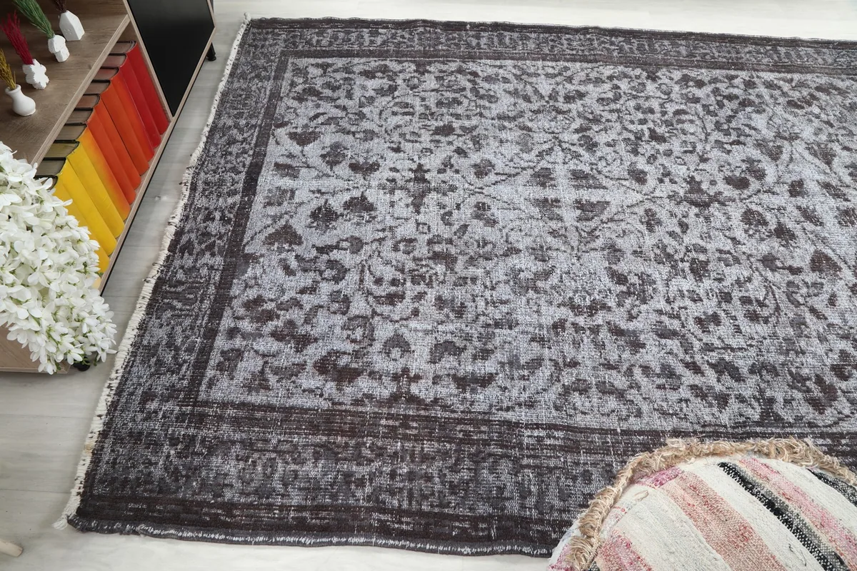 Wide angled view of the rug in a room, showing its full length and width