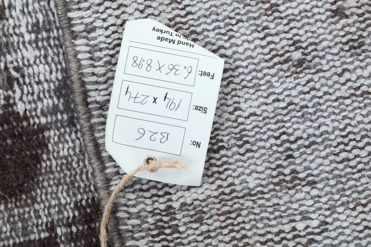 Close-up of the product tag showing the rug's size and origin details