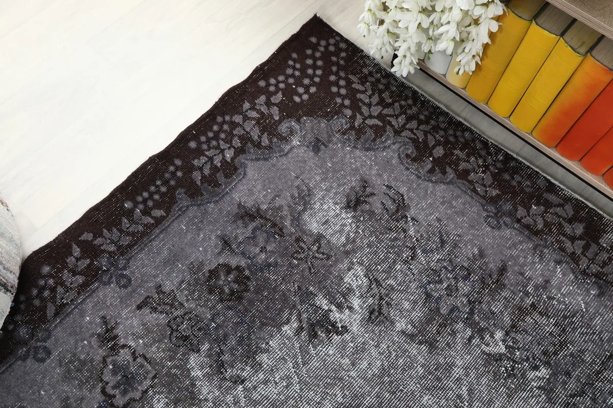 High angle view of a rug corner and border detail in a room