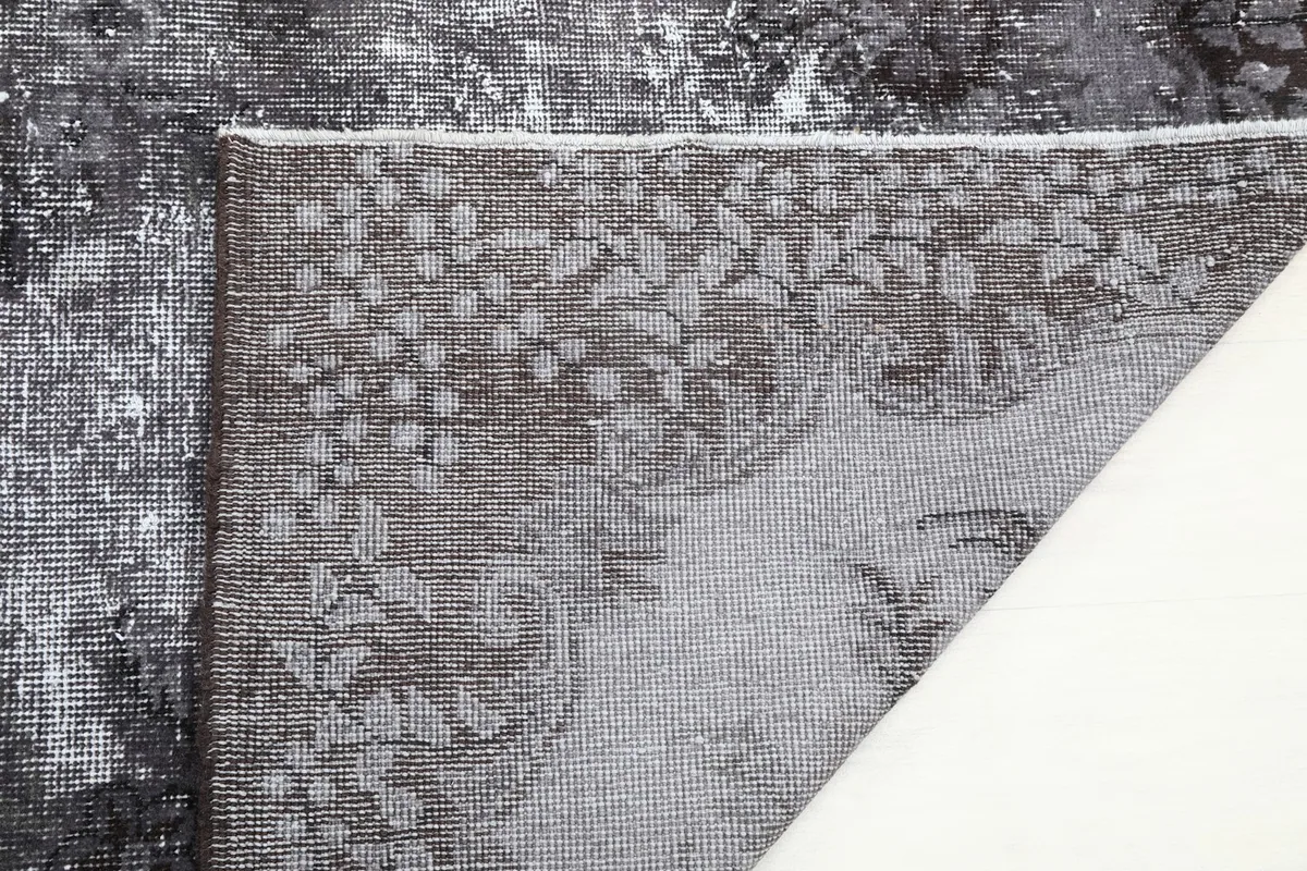 Close-up of the rug's reverse side, showing the tight weave and craftsmanship