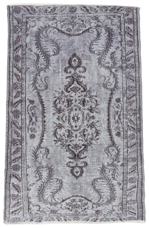 Full top view of the vintage charcoal gray floral medallion Anatolian rug