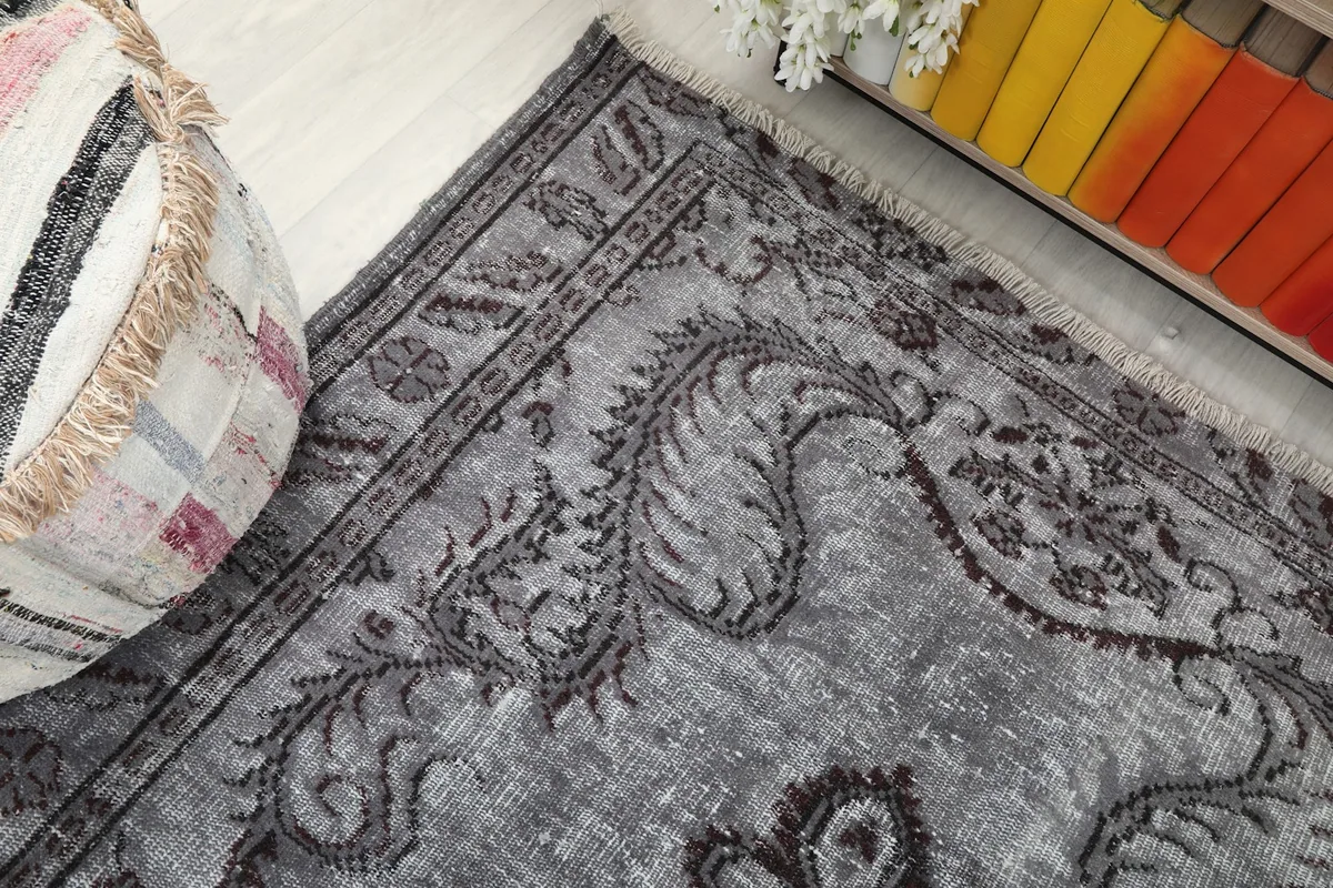Close-up of the rug's border pattern and corner detail with subtle fringe