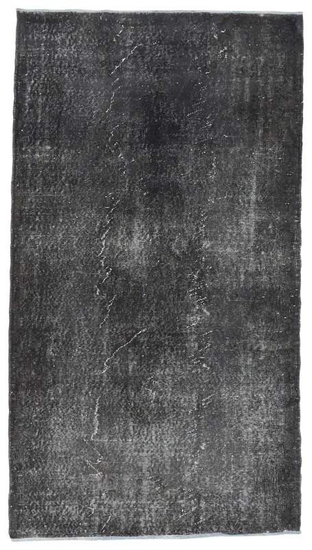 Full top view of the 3'8" x 6'9" charcoal vintage Anatolian area rug on a white background.