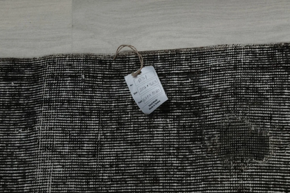 Tag on the back of the rug, showing product information and origin