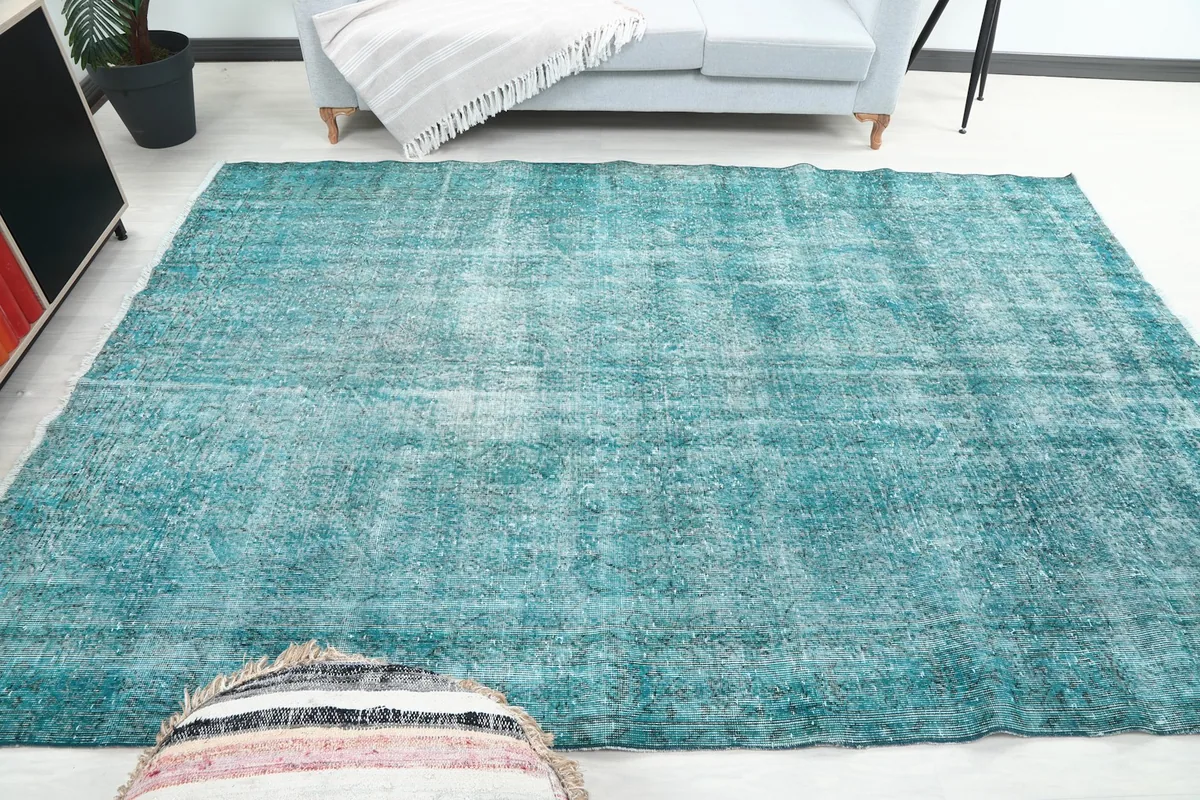 Another room shot of the blue rug, providing a different perspective of its integration with furniture.