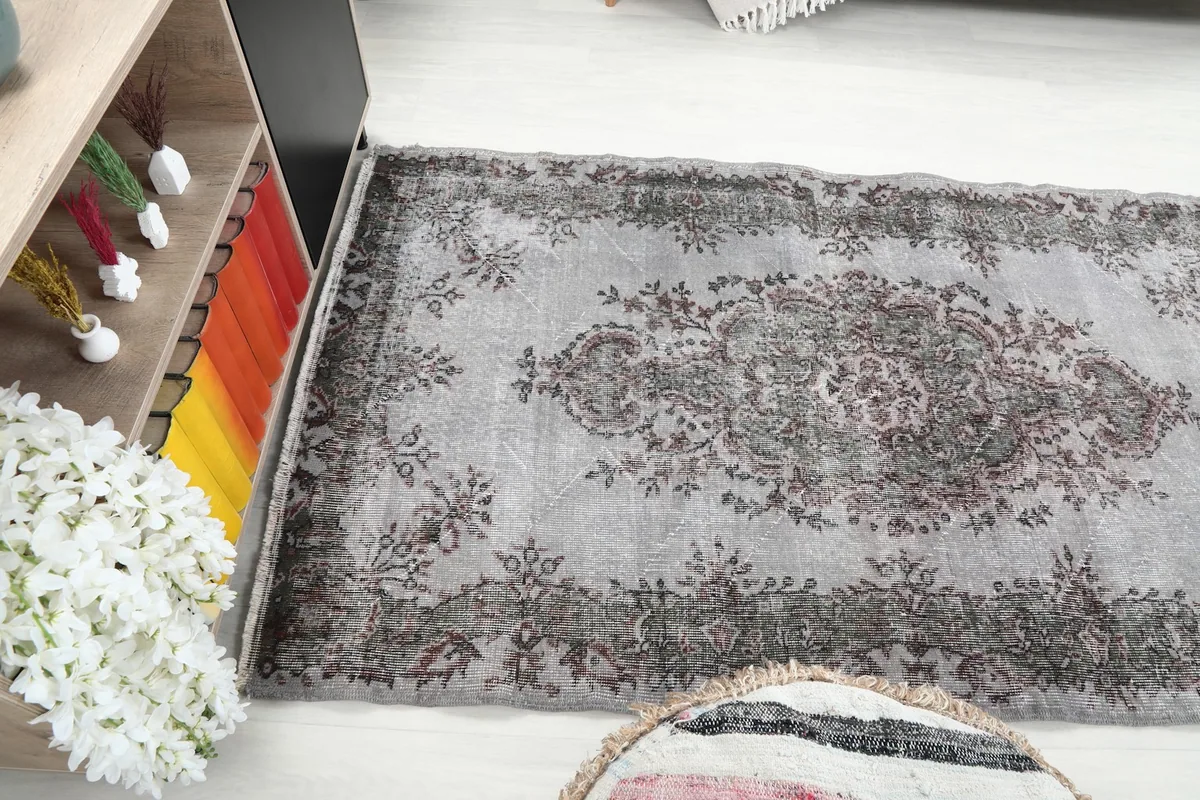 Wide angle view of the rug's length, showing its placement in a room setup