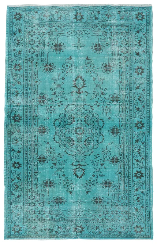 Full overhead view of the 5'4" x 8'8" blue and black vintage Anatolian area rug