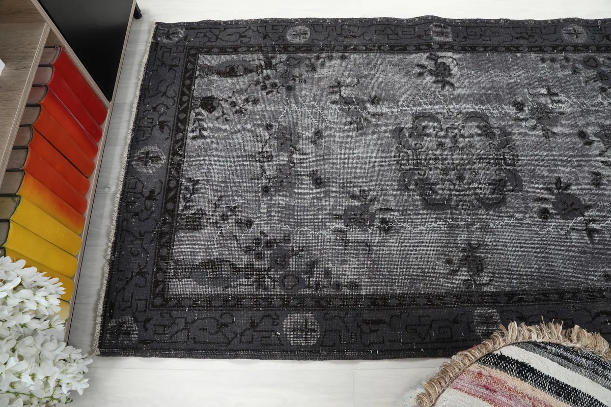 Angled shot of the rug's surface, capturing its texture and the subtle color variations