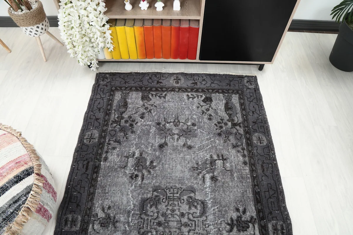 Overhead perspective of the vintage gray rug in a room, showing its overall layout